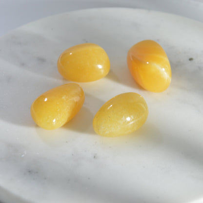 Orangen Calcit Trommelstein