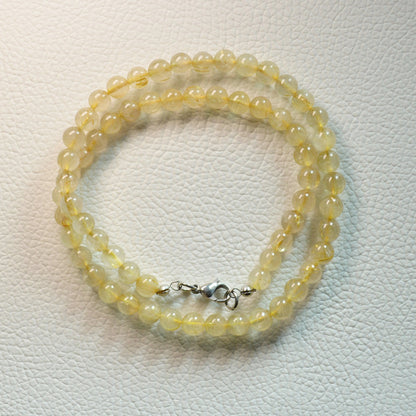 Gold Rutilquarz Halskette aus 6mm Natursteinperlen, 45 cm lang, mit Metallverschluss – sehr hochwertiger Edelsteinschmuck.