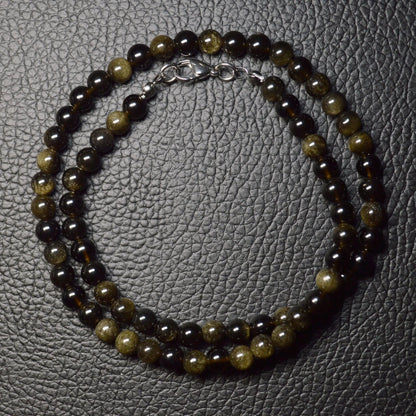 Elegante Gold-Obsidian Kette mit schimmernden 6mm Kristallperlen – perfekt als Geschenk oder für den Alltag.