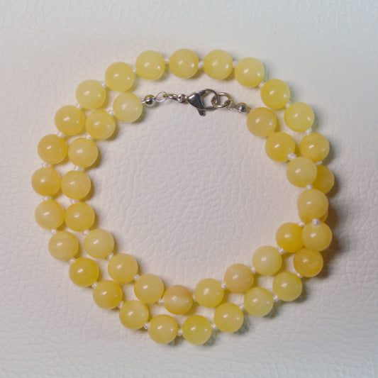 Elegante Orangencalcit Kette mit transparenten 8mm Kristallperlen – perfekt als Geschenk oder für den Alltag.